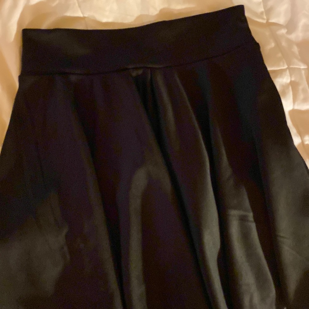 A black high waist skirt this is a cheerleader skirt